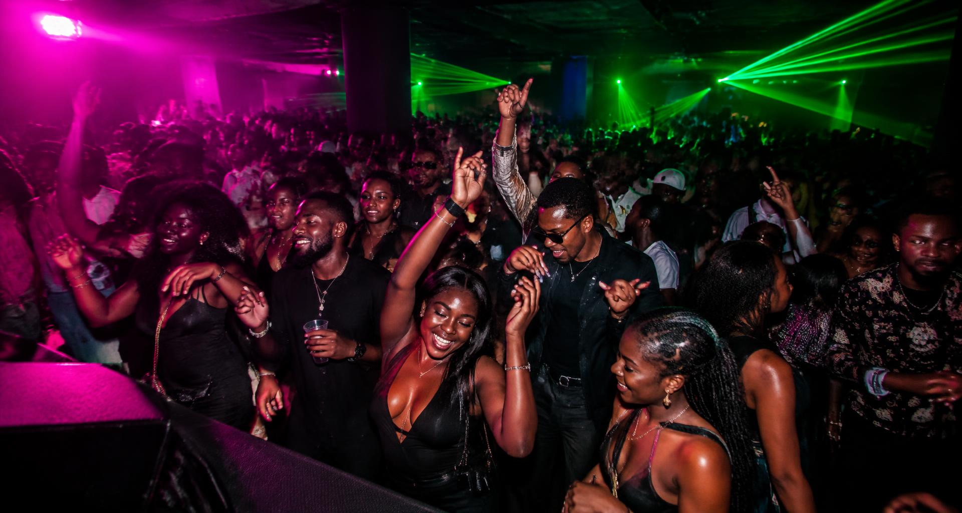 Illustrative Afrobeats crowd under pink and green lights